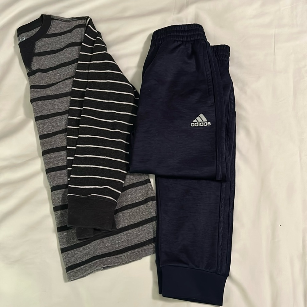 Adidas jogging pants and striped thermal shirt
